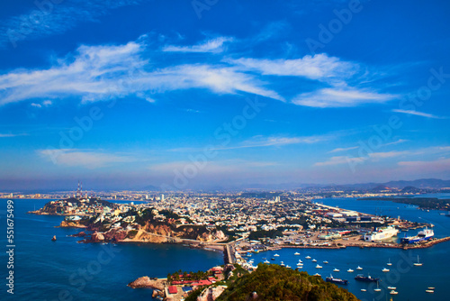 view of a city from the air surrounded by the ocean, city in island, mazatlan sinaloa 