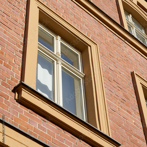 Facade of a house with window and brick facade in the city center of Wittenberg in Germany