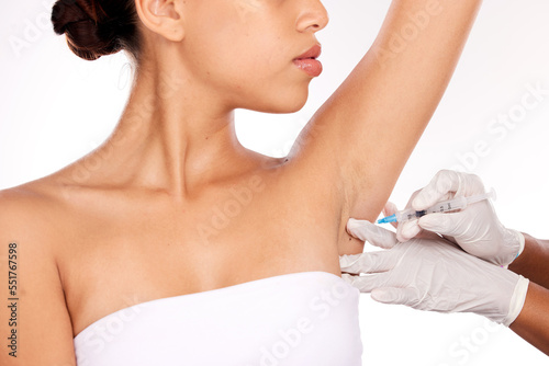 Beauty, armpit and injection for wellness aesthetic and professional treatment of hyperhidrosis. Plastic surgery doctor with cosmetic under arm botox syringe for girl patient in white studio.