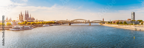 Great Panoramic view of the city of Koln, the Rhine River, bridges and various ferries and ships at the pier.