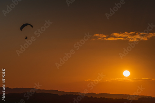 man flies a motor hang glider