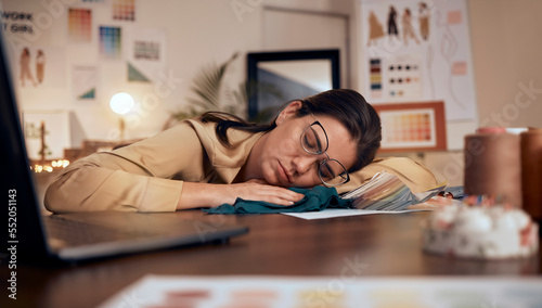Fashion designer, stress and sleeping on studio table in deadline pressure, startup fail or small business anxiety. Tired, asleep and exhausted creative in clothes workshop, mental health or burnout