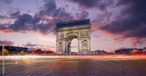 Arc de Triomphe(Arch of Triumph) Paris city at sunset. Long exposure panorama