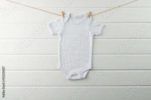 Close up of baby white t shirt with copy space on white background