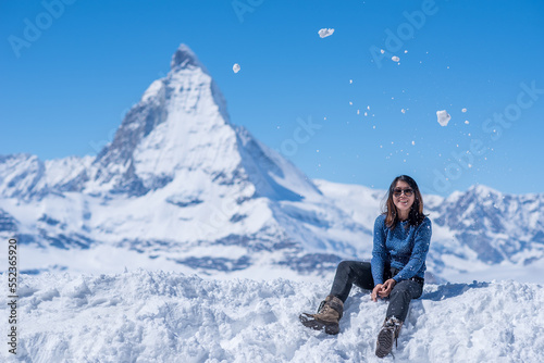 woman in winter clothes with matterhorn mountain in background