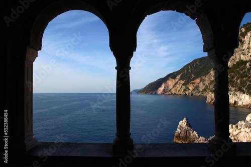 Loggia with arches overlooking the jagged Ligurian coast, dating back to the Benedictine abbey of the San Pietro church (Porto Venere, Cinque Terre, Liguria, Italy).