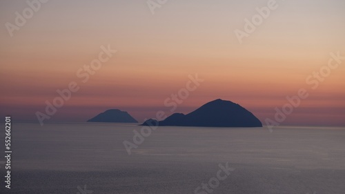 Aeolian Islands, Sicily. At sunset, the silhouettes of Filicudi and Alicudi islands, from Salina island.