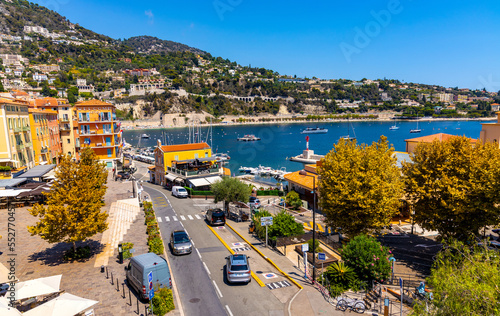 Panoramic view of harbor, yacht marina and beach onshore Mediterranean Sea in Villefranche-sur-Mer resort town in France