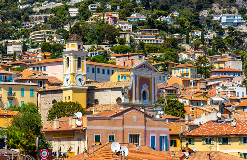 Historic old town quarter with St. Michael church onshore Azure Cost of Mediterranean Sea in Villefranche-sur-Mer resort town in France