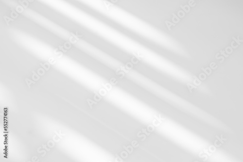 Gray shadow and light blur abstract background on white wall from window. Dark grey shadows indoor in room background, monochrome, shadow overlay effect for backdrop and mockup design