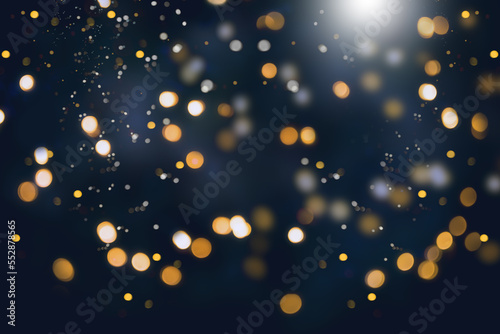 Abstract gold and silver christmas bokeh on dark blue background.