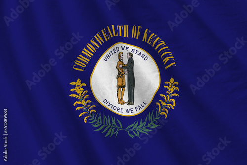 Kentucky US state flag with big folds waving close up under the studio light indoors. The official symbols and colors in fabric banner