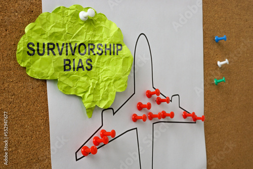 Paper brain with the inscription survivorship bias pinned to the board.