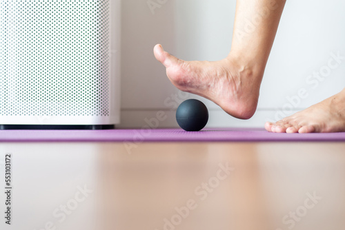 Woman massage with rubber ball on feet,Foot soles massage for plantar fasciitis