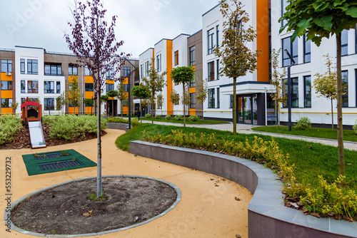 Green recreation area in the courtyard of a multi-storey building