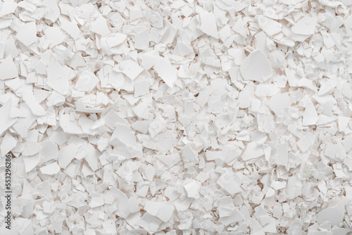 White eggshell background. Broken eggshells. Natural texture