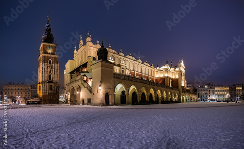 Night view of the Cloth Hall and Town Hall tower on Main Square in Krakow, Poland
