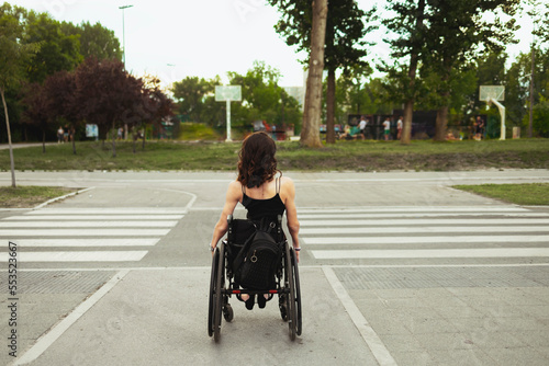 Young determined woman with paraplegia smiling.