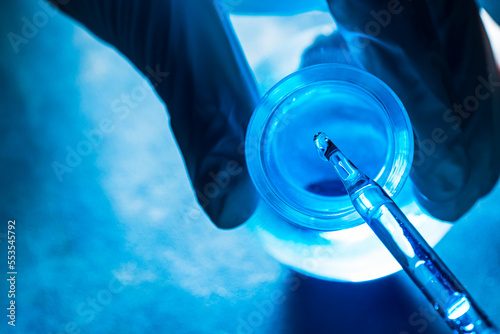 blue science test tube,Researchers scientist working analysis with blue liquid test tube in the laboratory, chemistry science or medical biology experiment technology, pharmacy development solution