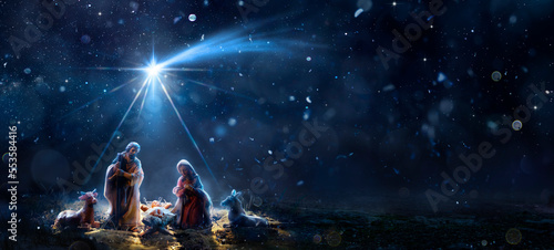 Nativity Of Jesus With Comet Star - Scene With The Holy Family In Snowy Night And Starry Sky - Abstract Defocused Background