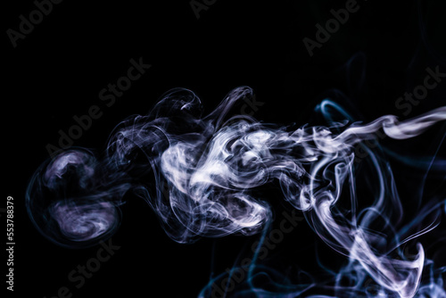 Smoke on an isolated black background. Studio macro photography. Close-up .