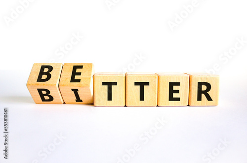 Better or bitter symbol. Concept word Better and Bitter on wooden cubes. Beautiful white table white background. Business and better or bitter concept. Copy space.