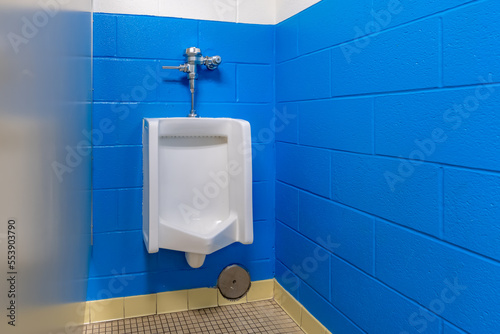 white urinal in men's bathroom 