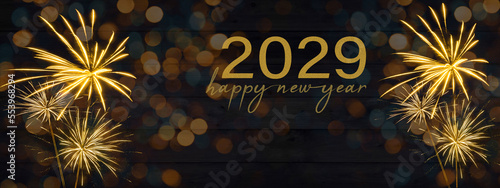 Sylvester, New Year's Eve, Happy new Year 2029 Party, Firework celebration background banner - Golden fireworks and bokeh lights on black wooden wall texture in the night