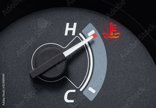 Needle pointer at the high temp point of the temperature gauge in the vehicle radiator and the symbol has the red light is on