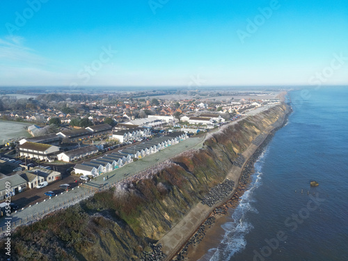 Aerial view of coastal holiday homes and chalets seen near a cliff top on the English east coast.