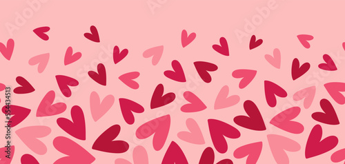 Abstract seamless pattern with pink and red hearts on pink background. Hand drawn doodle style. Great for Valentine's Day, Wedding, Mother's Day