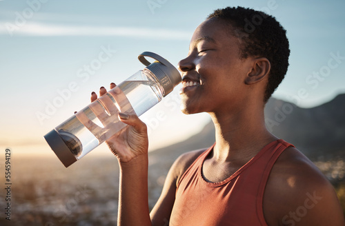 Water, relax and black woman training in nature, happy hiking and fitness progress in Taiwan. Hydration, thirsty and African runner with a drink after sports exercise, running and morning workout