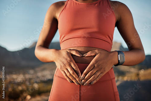 Woman, nature fitness or hands on stomach in diet wellness, body healthcare or abs muscle growth in workout training or sunrise exercise. Zoom, sports athlete or person, belly digestion or strong gut