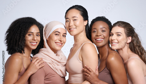 Diversity, woman and beauty portrait for body positive support, happiness and skincare wellness. Interracial models, happiness solidarity and smile for skin glow, cosmetics dermatology in studio