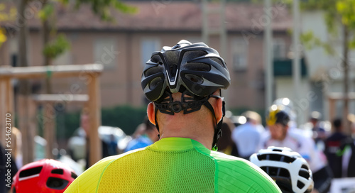 cyclist with helmet of protection and other cyclists before the cycling race