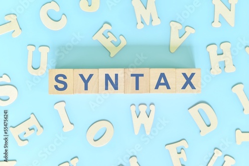 Study syntax in linguistics concept. Wooden blocks word typography flat lay in blue background.