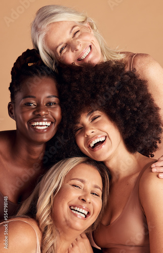 Diversity, beauty and natural with woman friends in studio on a beige background to promote skincare. Portrait, face and smile with a happy female and friend group indoors for luxury cosmetics