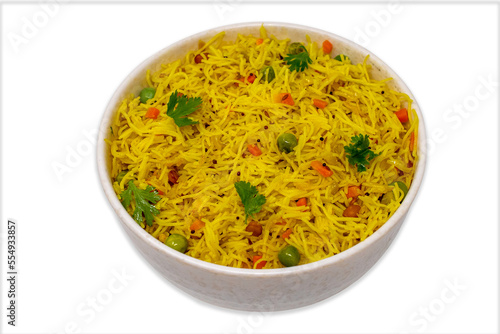 Homemade healthy delicious vermicelli semiya uppittu upma semolina with onion, peas, carrot, curry leaves, dry chilli, popular south indian breakfast menu on a white bowl