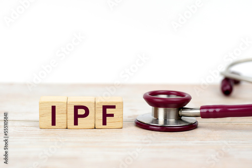 Word IPF ( Idiopathic pulmonary fibrosis ) on wooden blocks and stethoscope on white background. lung disease, Medical, health care. Health insurance. clinic and medical business.