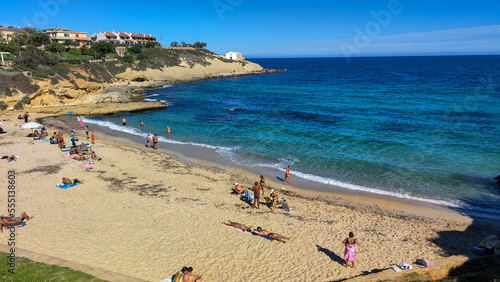 People sunbathing on the Beach of Balai at Porto Torres on Sardinia in Italy