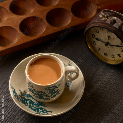 Fresh milk tea or doodh patti and chai served in cup isolated on table side view healthy morning drink