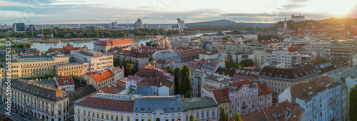 Bratislava, Slovakia - August 26, 2022: Aerial view of city center at sunset. Panoramic viewpoint from drone