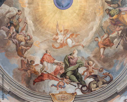 DOMODOSSOLA, ITALY - JULY 19, 2022: The baroque fresco of Apotheosis of St. Charkes Borromeo in cupola of the church Chiesa dei Santi Gervasio e Protasio by Lorenzo Peretti (1774 – 1851).