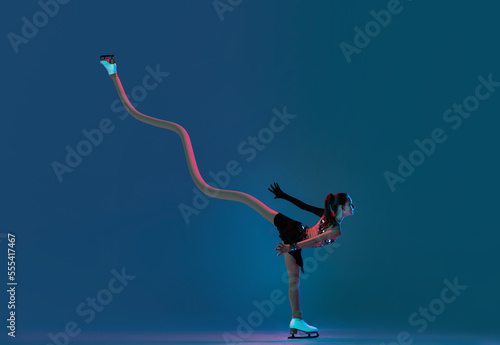 Contemporary art collage. Creative design. Dynamic portrait of young girl, female figure skater in black stage dress skating on blue background in neon light