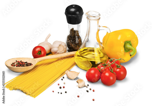 Spaghetti, vegetables and other ingredients on desk