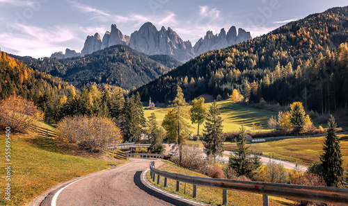 Stunning alpine Landscape at autumn. Santa Maddalena one of the most popular photo spot of Dolomite. Famous World place. Dolomites Alps. Italy. Amazing Nature background. Vivid landscape in fall
