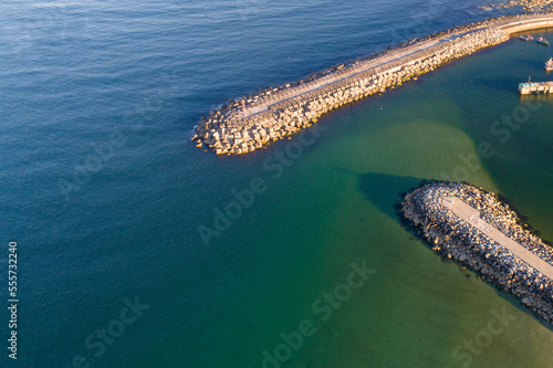 drone aerial view of a port harbor breakwater