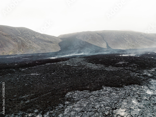 Black volcanic lava rock spread across the valley near Geldingadalir active Volcano