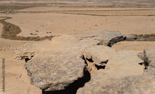 Plain rock viewpoint to the desert, focus on rock