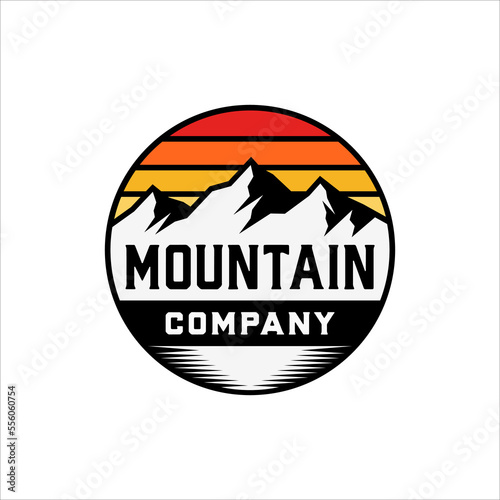 Mountain logo in round badge with retro style design
